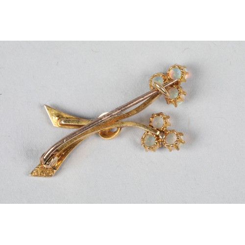 68 - 15 carat gold opal brooch of stylised floral form, length 36mm, weight 3g