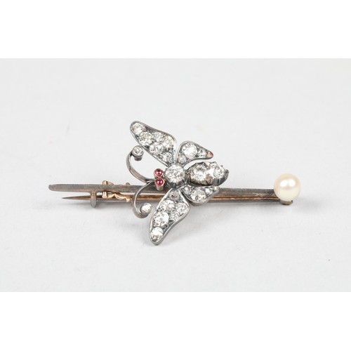 59 - Diamond butterfly brooch, set with old cut diamonds and ruby eyes mounted to an unmarked pin with a ... 