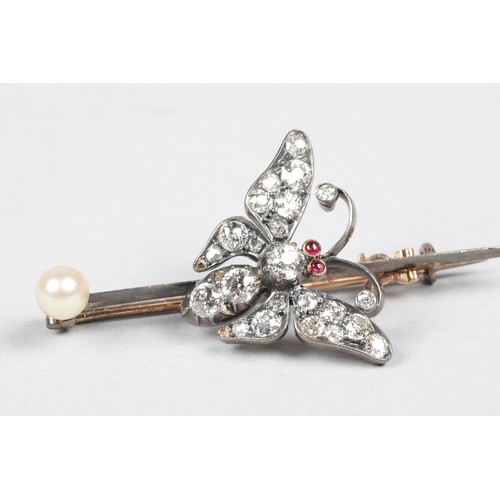 59 - Diamond butterfly brooch, set with old cut diamonds and ruby eyes mounted to an unmarked pin with a ... 