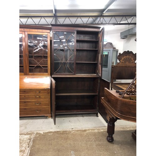 474 - 19th century mahogany bookcase, plain cornice over a pair of astragal glass doors above twin cupboar... 