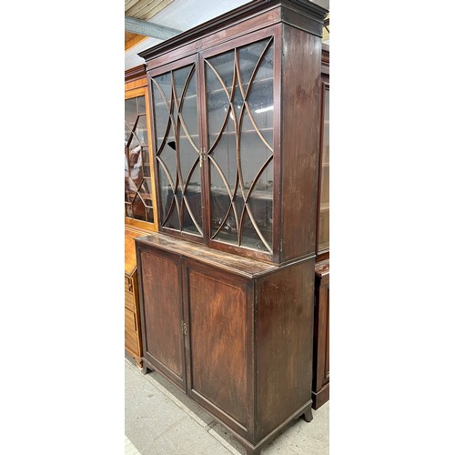 474 - 19th century mahogany bookcase, plain cornice over a pair of astragal glass doors above twin cupboar... 