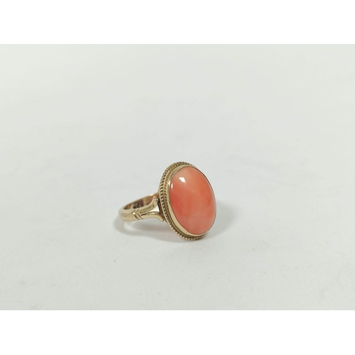 152 - Ring with oval coral cabochon in 9ct gold, size 'L½' and an opal set pin. (2) 