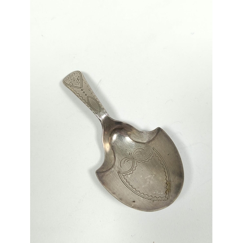 55 - Rare silver caddy spoon with shield shaped bowl and pin struck decoration, with the Double Duty mark... 