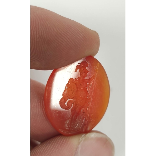 68 - Georgian oval carnelian intaglio of a standing female classical figure grasping a pike, 25mm x 20mm,... 