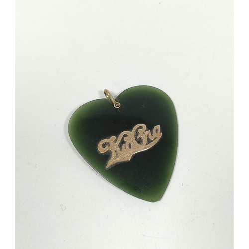 69 - New Zealand greenstone heart pendant with gold pierced 'Kia Ora' and loop '9ct' approx. 45mm x 41mm.