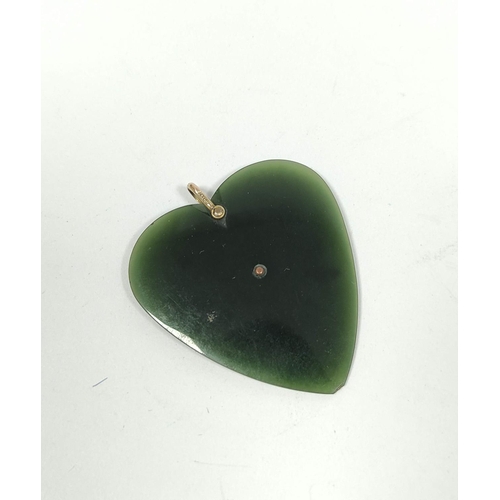 69 - New Zealand greenstone heart pendant with gold pierced 'Kia Ora' and loop '9ct' approx. 45mm x 41mm.