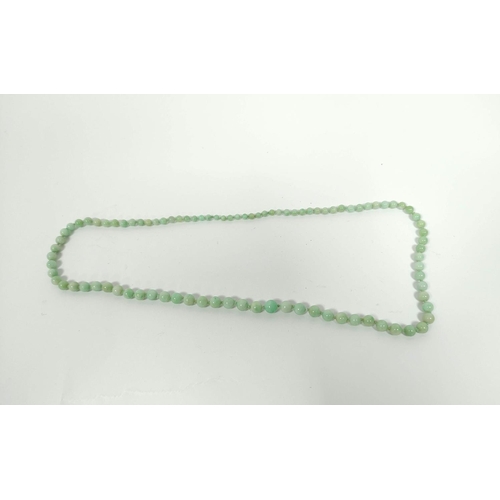 83 - Jadeite bead necklace of graduated green beads, the largest 10mm.