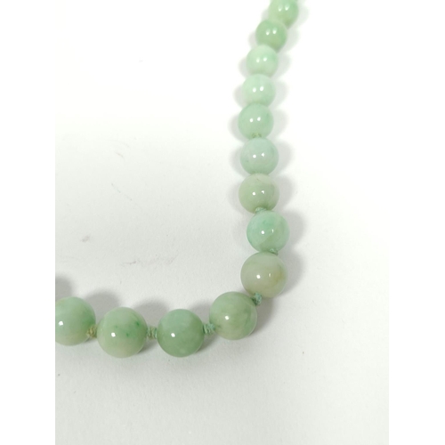 83 - Jadeite bead necklace of graduated green beads, the largest 10mm.