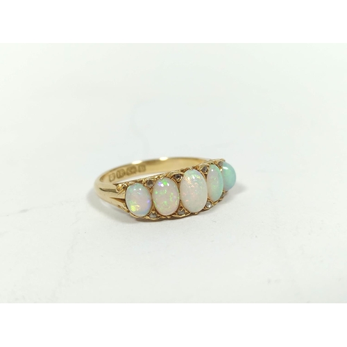 88 - Victorian opal ring with five graduated diamond points in pierced carved 18ct gold, Birmingham 1895.