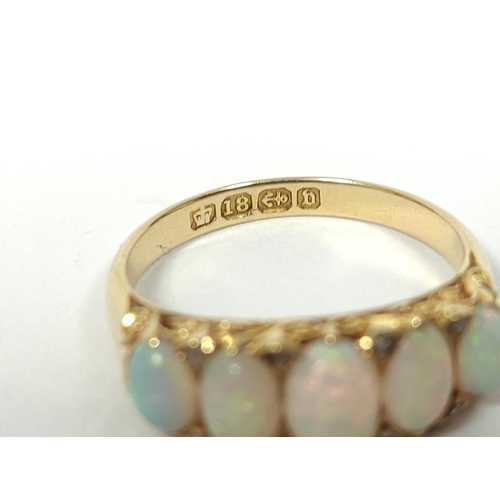 88 - Victorian opal ring with five graduated diamond points in pierced carved 18ct gold, Birmingham 1895.