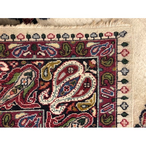 468 - Persian rug, cream ground with a central circular medallion in green blue and red, length 179cm, wid... 