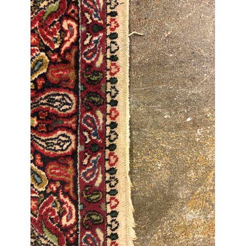 468 - Persian rug, cream ground with a central circular medallion in green blue and red, length 179cm, wid... 