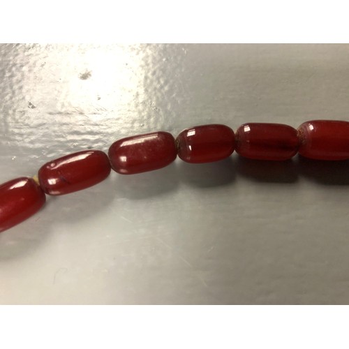 113 - Cherry amber bead necklace, length 75cm, largest bead 21mm, total weight 70g