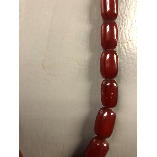 113 - Cherry amber bead necklace, length 75cm, largest bead 21mm, total weight 70g