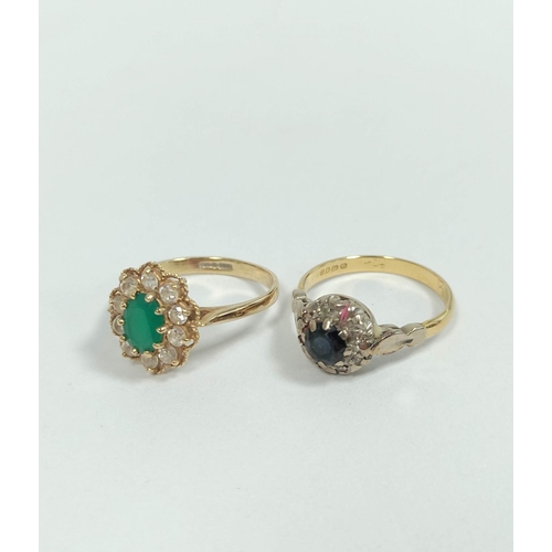 124 - Emerald cluster ring in 9ct gold and another, 18ct. (2). 