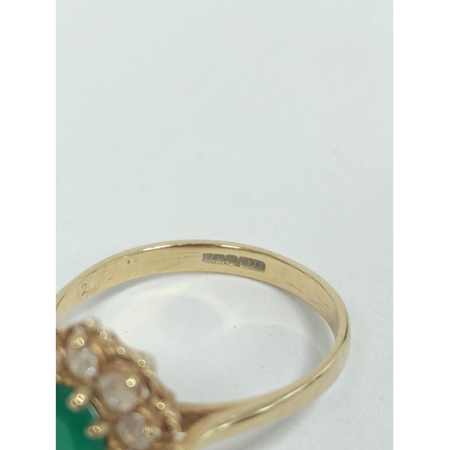 124 - Emerald cluster ring in 9ct gold and another, 18ct. (2). 