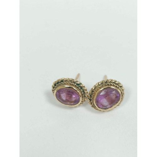 125 - Cameo brooch and a pair of amethyst earrings both 9ct gold. 