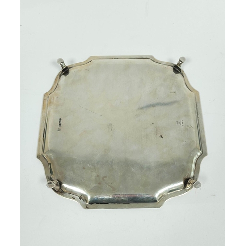 131 - Silver tray of shaped square form with bath border on pad feet, Sheffield 1931, 22cm, 465g / 14½oz.