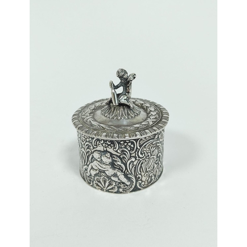 132 - Dutch silver cylindrical box, embossed, with putlo finial by B. Miller 1910, 6cm diameter, 88g / 2&f... 