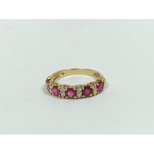 134 - Diamond and ruby five stone ring, in gold '730', size 'M½'. 