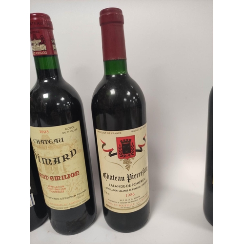 215 - Twelve bottles of French Bordeaux and red wines to include two bottles of Château Simard Saint-Emili... 