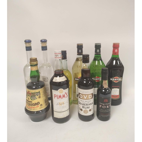 224 - Eleven bottles of assorted spirits and liqueurs to include bottles of Martini, 15% vol, 100cl, Pimms... 