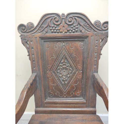 400 - 17th century and later oak wainscot armchair, North of England, the carved panelled back above shape... 