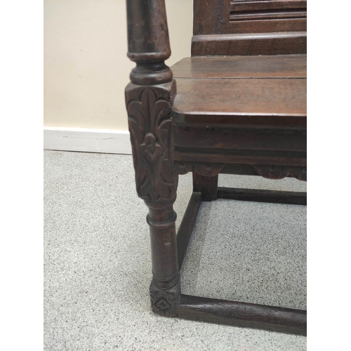 400 - 17th century and later oak wainscot armchair, North of England, the carved panelled back above shape... 