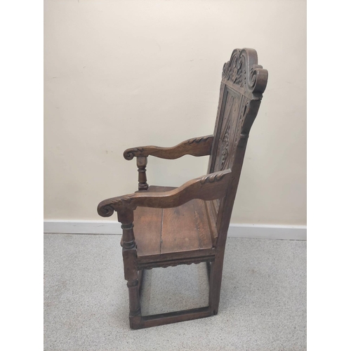 400 - 17th century and later oak wainscot armchair, North of England, the carved panelled back above shape... 