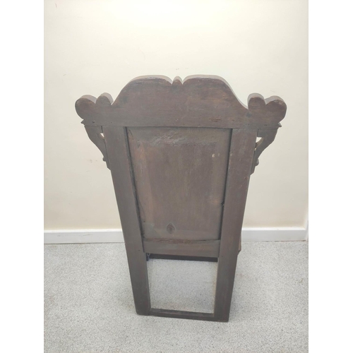 400 - 17th century and later oak wainscot armchair, North of England, the carved panelled back above shape... 