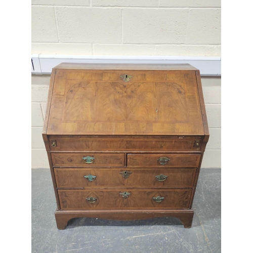 402 - 18th century feather banded walnut and pine bureau, the fall front enclosing a fitted interior of pi... 