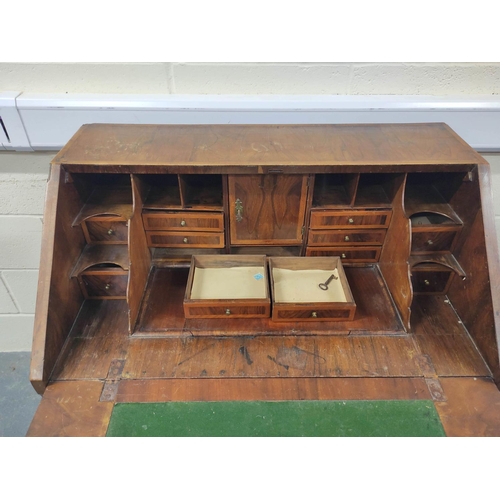 402 - 18th century feather banded walnut and pine bureau, the fall front enclosing a fitted interior of pi... 