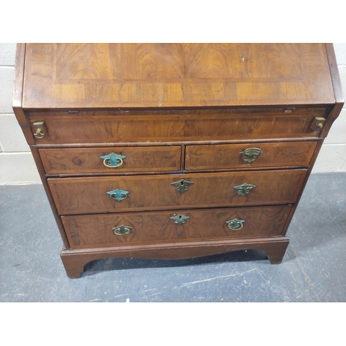 402 - 18th century feather banded walnut and pine bureau, the fall front enclosing a fitted interior of pi... 