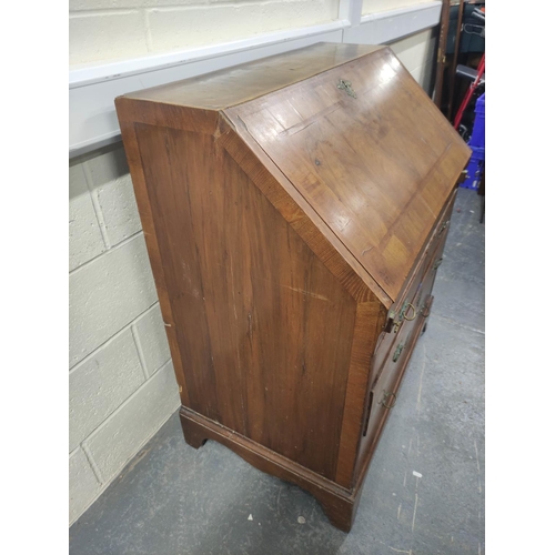 402 - 18th century feather banded walnut and pine bureau, the fall front enclosing a fitted interior of pi... 