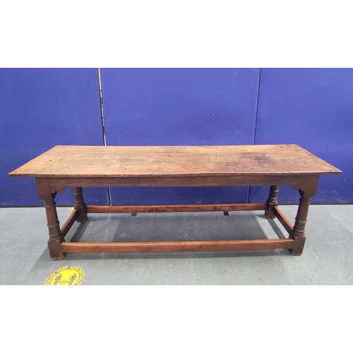 404 - 17th century style oak refectory table, with fixed plank top, above a carved frieze, raised on turne... 