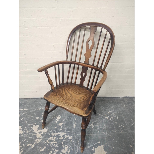 407 - Ash Windsor armchair, the hoop frame with spindle back and pierced splat, on turned supports, united... 