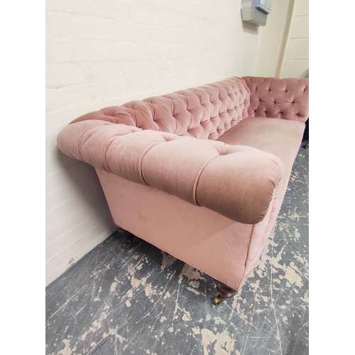 414 - Victorian Chesterfield style sofa upholstered in later pink button back velour, on mahogany turned s... 