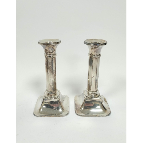 155 - Pair of silver candlesticks with octagonal stems, Birmingham 1924, 15cm (loaded).