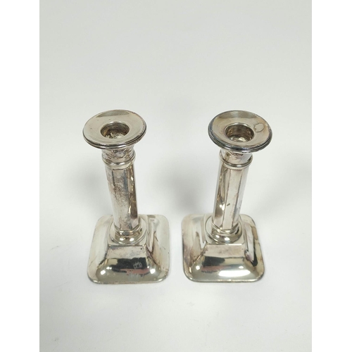 155 - Pair of silver candlesticks with octagonal stems, Birmingham 1924, 15cm (loaded).