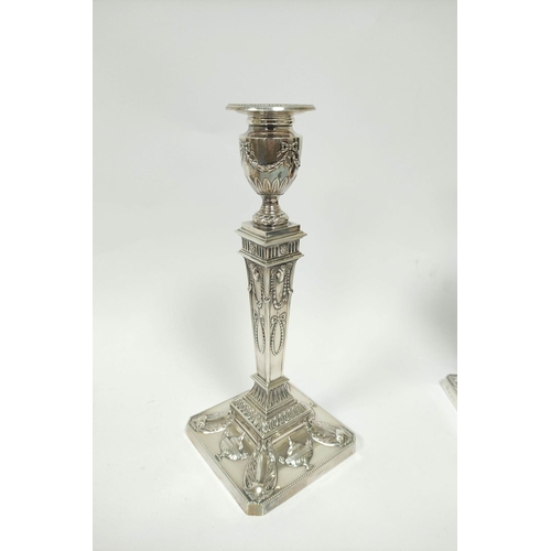 159 - Pair of silver table candlesticks of Neo Classical Adams style, with square inverted tapering stems ... 