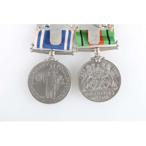 446 - Medals of Police Constable Norman W Marsh comprising an Elizabeth II Police long service and good co... 