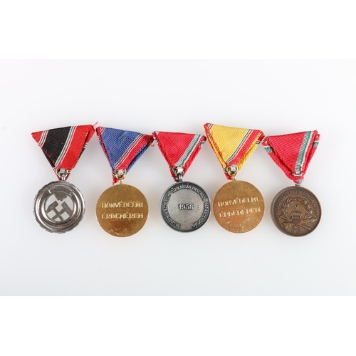 603 - Five Hungarian Fire Brigade service medals including five and ten year long service medals dated 195... 