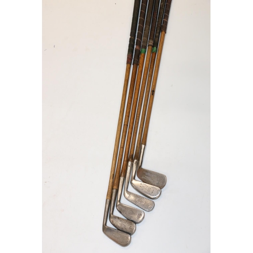 221 - Group of six hickory shafted golf clubs to include W Bee of Leacowe Golf Club iron, Hendry and Bisho... 