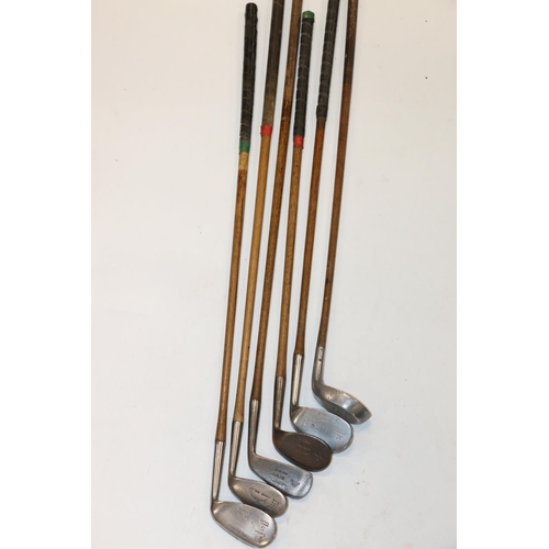 223 - Group of six hickory shafted golf clubs to include Willie Robertson of Blundellsands rustless iron, ... 