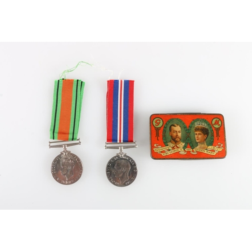 403 - WWII war medal and Defence medal in cardboard issue box addressed to 'Margaret Napier, Dunainds, Bir... 