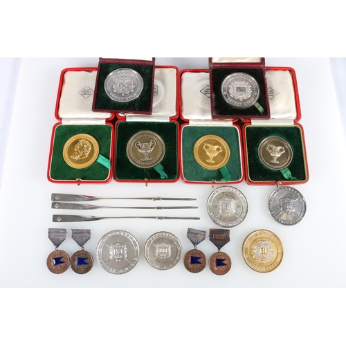 677 - Rowing interest, a group of rowing medals to include a white metal Oxford V Cambridge Putney medal [... 