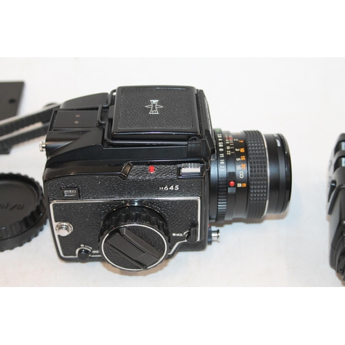 215 - Mamiya 645 camera, serial number J79324, with Mamiya-Sekor 1:2.8 f=80mm lens, serial number 61106, w... 