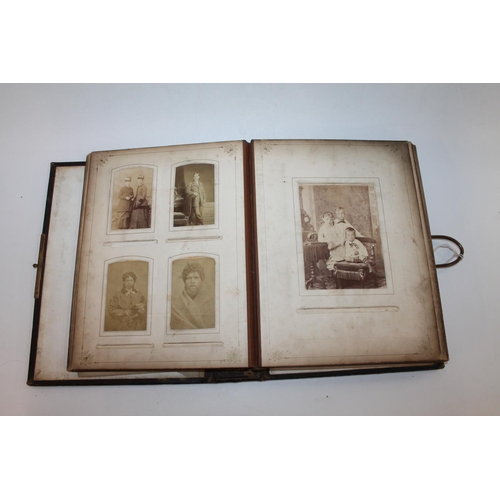 244 - A Victorian album of cabinet cards, most of which are family portraiture, over 150 cards in all.