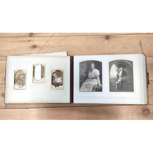 25 - Photographs. Victorian dark morocco oblong album with clasp (defective spine), dec. card leaves, par... 