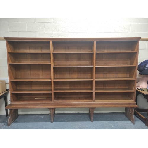 390 - Oak open library bookcase, c.1870's, in the manner of Philip Webb, the moulded pediment above three ... 